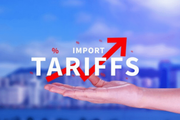 Graphic showing the rising Tariff Impact, with an upward red arrow and the text 'IMPORT TARIFFS' held by a hand.