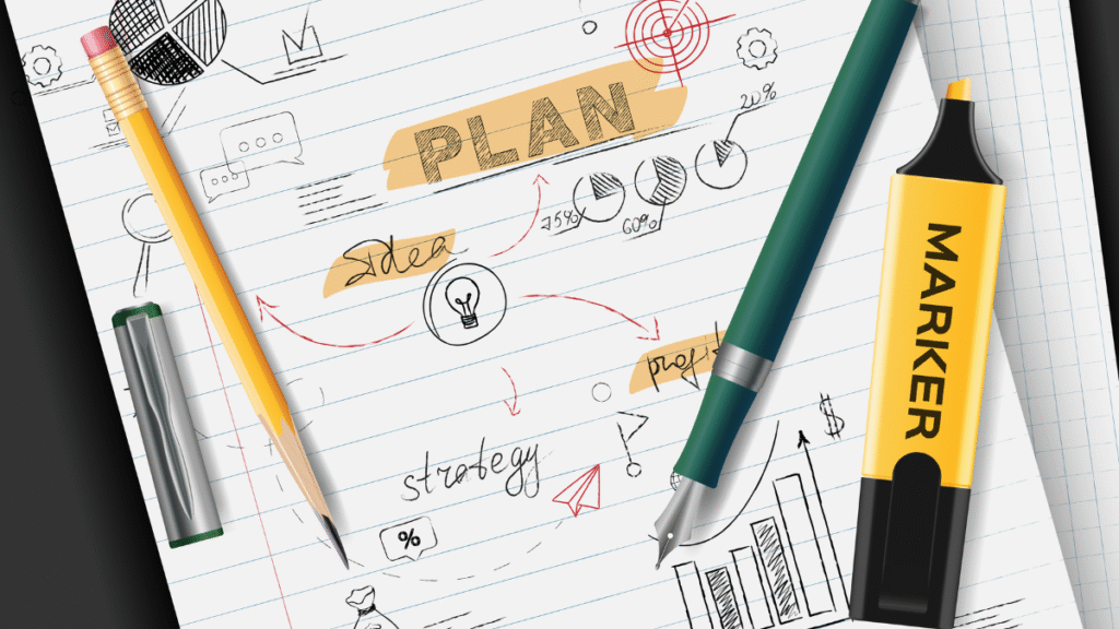 A notebook page showing the process of creating a student education plan with hand-drawn charts, a target, and the words "strategy" and "idea."