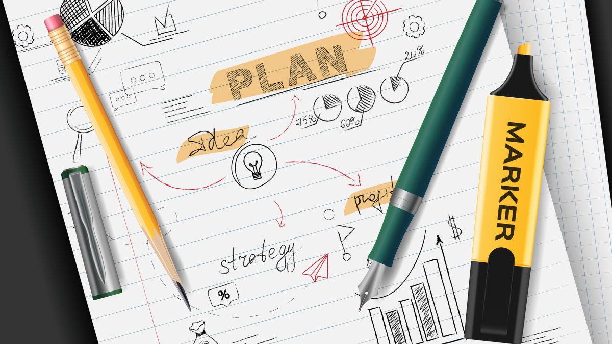 A notebook page showing the process of creating a student education plan with hand-drawn charts, a target, and the words "strategy" and "idea."
